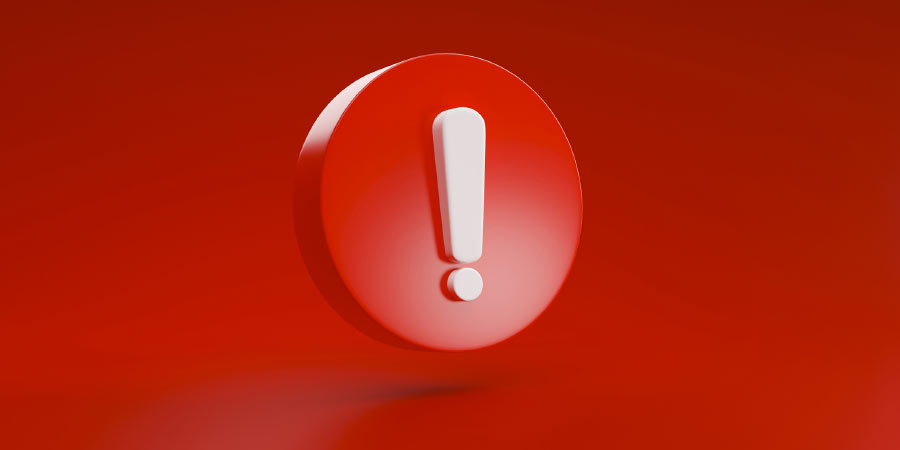 Huge red warning symbol on a red background indicating red flags in a relationship