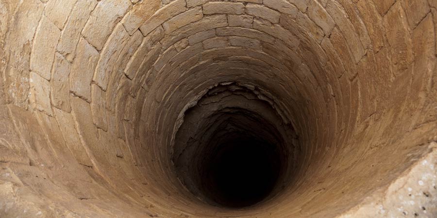 An ancient deep well photographed to portray dilation