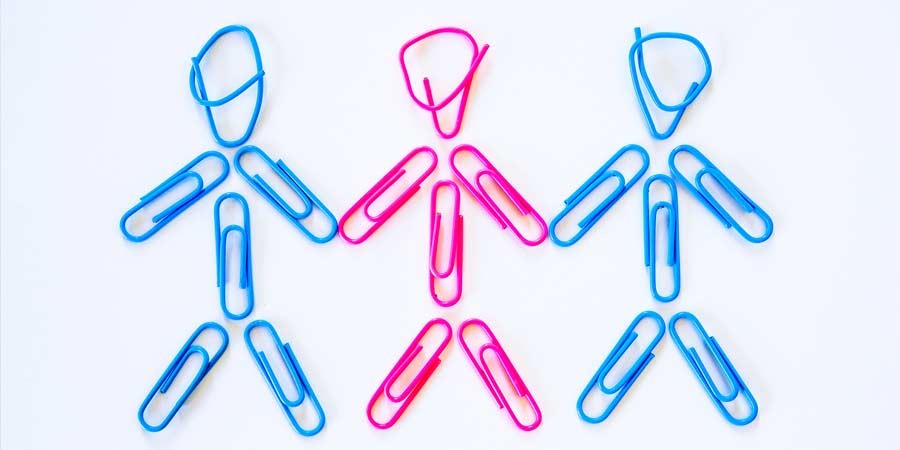 Compilation of blue and pink paper clips to signify a polyamorous relationship