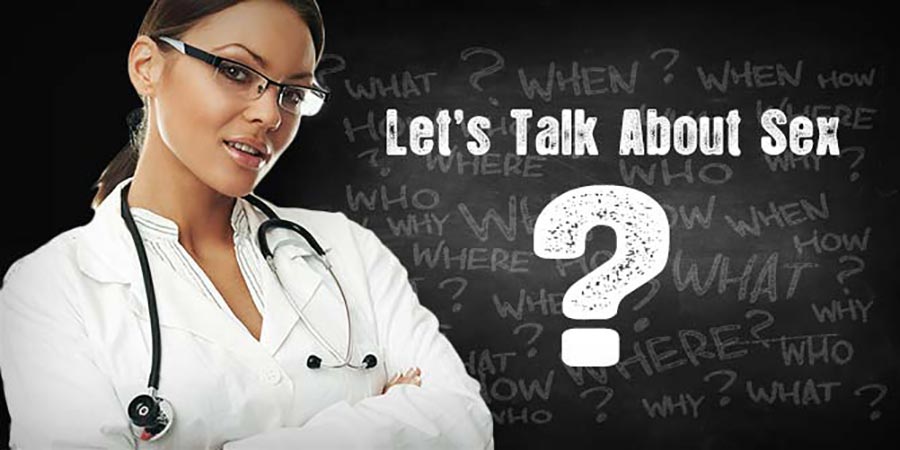 Attractive woman in medical coat and glasses ready to answer sex related questions